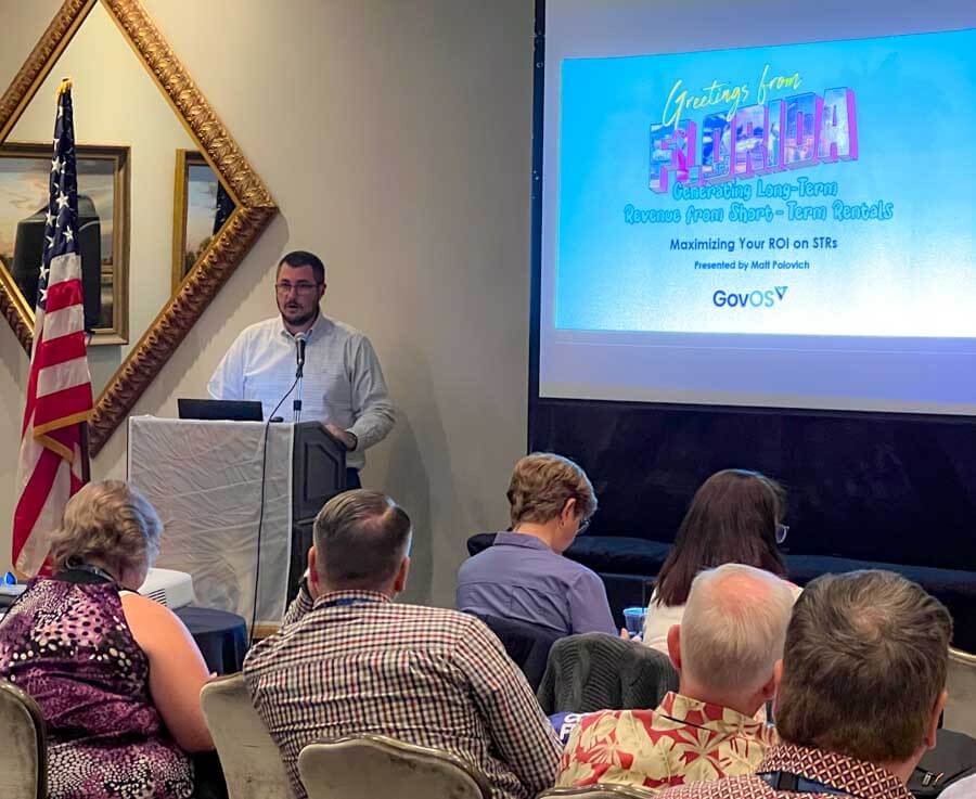 GovOS Employee Presenting at a Conference