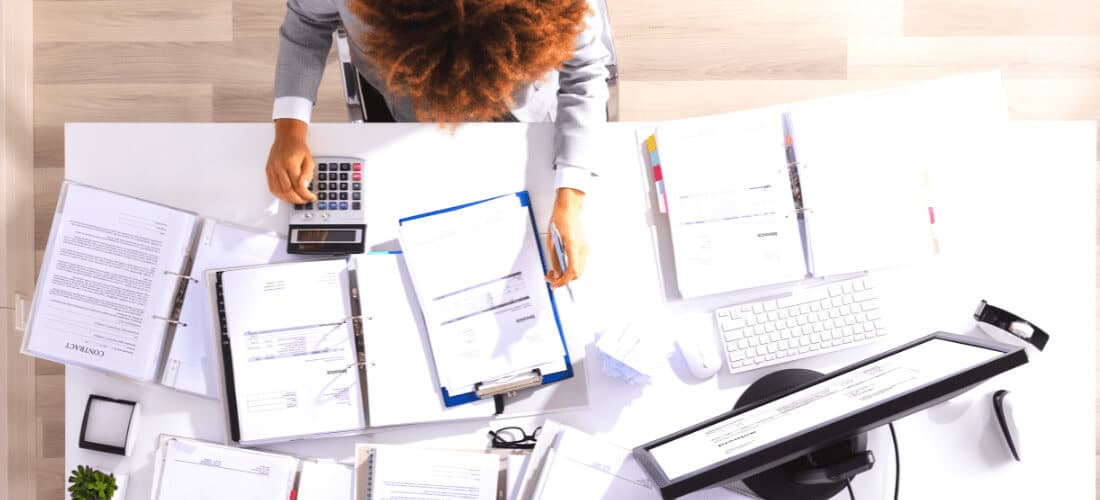 Government employee calculating invoice Government employee calculating invoice