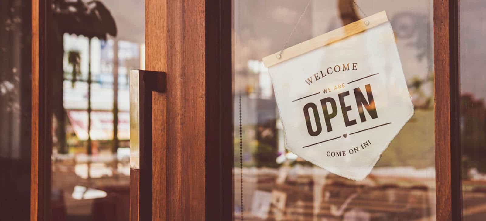 Text on vintage white business sign saying welcome we are open come on in Text on vintage white business sign saying welcome we are open come on in
