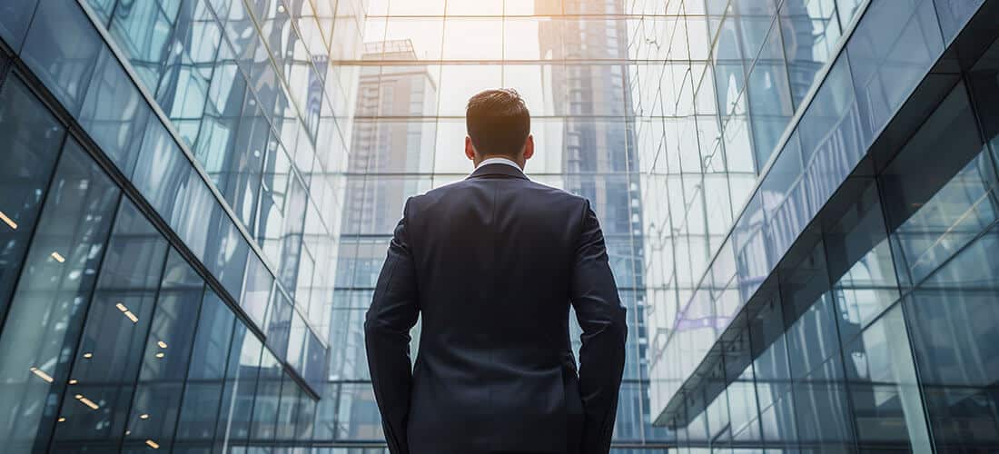 Businessman in front of business offices Businessman in front of business offices
