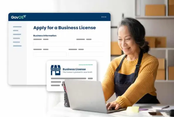 Business-owner-filling-out-business-license Business owner applying for a business license.