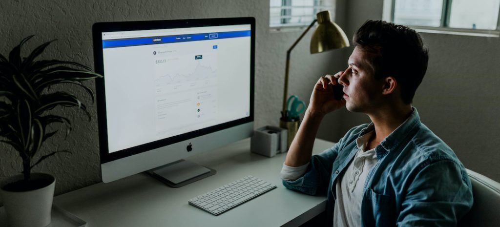 An image of a man making a payment online.