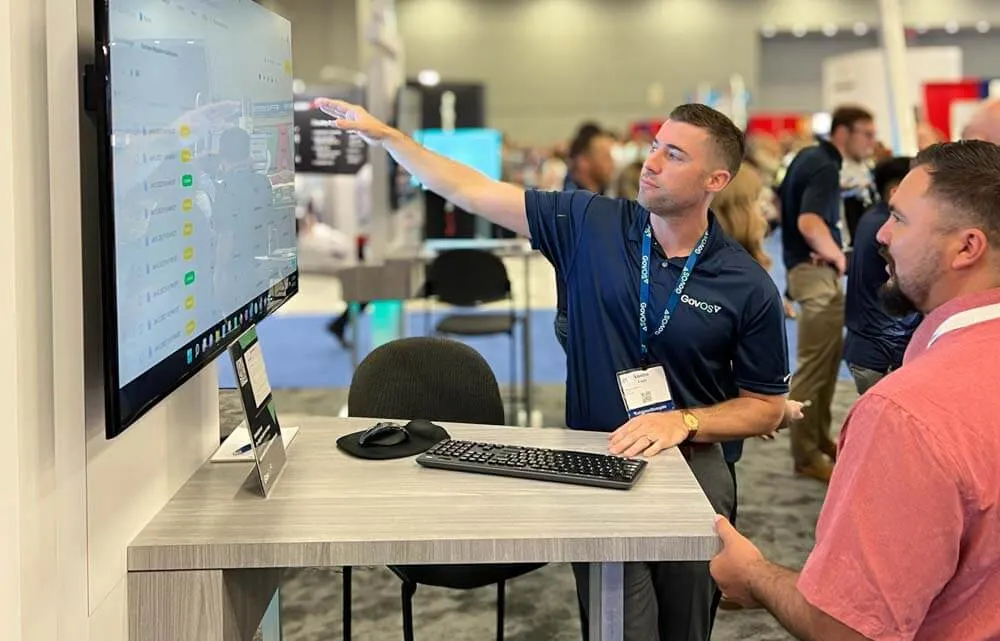 GovOS Solution Consultant Demoing at a Tradeshow GovOS Solution Consultant Demoing at a Tradeshow