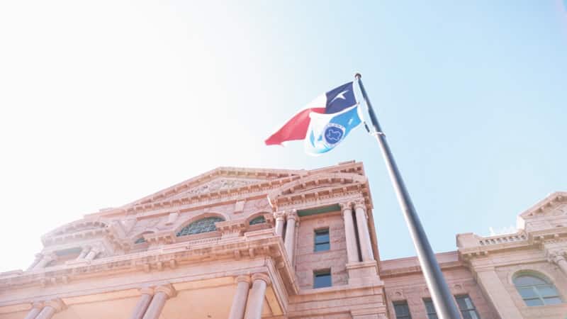 Texas flag outside of the Tarrant County, TX courthouse.