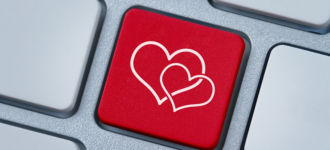 Online love, two hearts symbol at the computer key