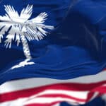 The South Carolina state flag waving along with the national flag of the United States of America