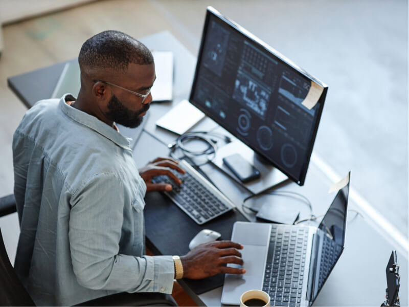 Person looking at data dashboard at their desk